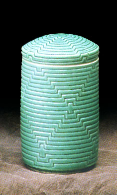 Tall carved jar